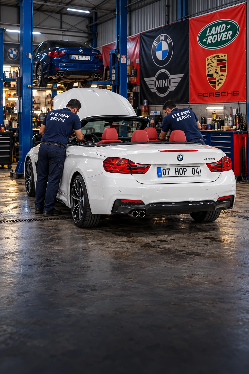 EFE BMW Özel Servis Kumluca atölyesinde BMW araç üzerinde çalışan ustalar